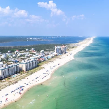 Aerial view of Perdido Key's white-sand beach and emerald Gulf waters