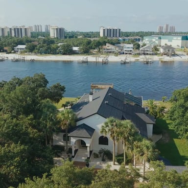 Aerial view of a LunaSol waterfront vacation rental on the Gulf Coast