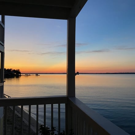 Gulf Coast sunset viewed from a waterfront deck